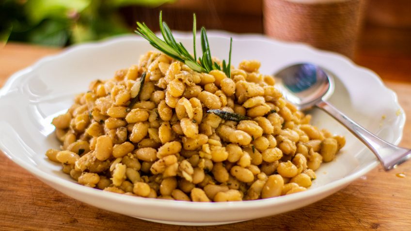 A very basic white bean recipe that’s healthy and full of fibre. This will adapt to any white bean recipe but the cannellini kidney shape bean seems to hold up its shape a lot better. It’s a basic dish that’s very tasty, you need to use a good quality first pressed virgin olive oil for great results. Use freshly cracked pepper and if you can, fresh rosemary. It’s best to salt last so they retain their shape. Older beans will take longer to cook, 30 to 45 minutes, fresher beans can cook as quickly as 20 minutes. The bicarbonate of soda adds an alkaline that helps the bean keep their shape and speeds up the cooking process. This step is optional.